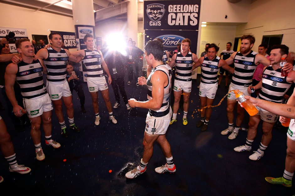 AFL 2015 Rd 10 - Essendon v Geelong MELBOURNE, AUSTRALIA - JUNE 06: Michael Luxford of the Cats is showered in Gatorade by team mates after the 2015 AFL round ten match between the Essendon Bombers and the Geelong Cats at Etihad Stadium, Melbourne on June 6, 2015. (Photo by Darrian Traynor/AFL Media/Getty Images)